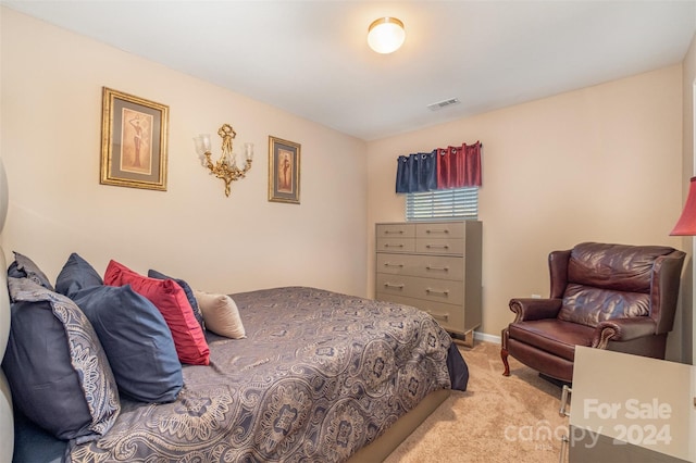 bedroom with light colored carpet