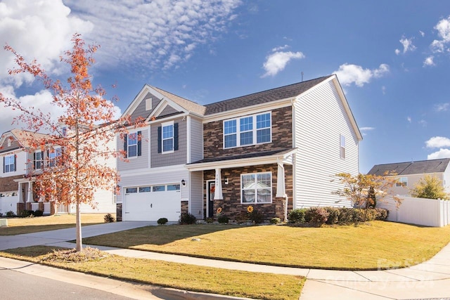 view of front of house featuring a garage and a front yard