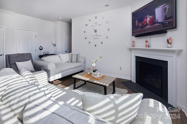 living room featuring dark hardwood / wood-style floors