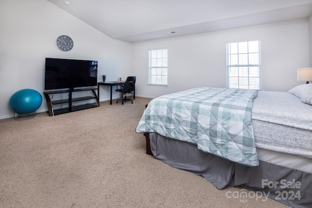 carpeted bedroom with vaulted ceiling