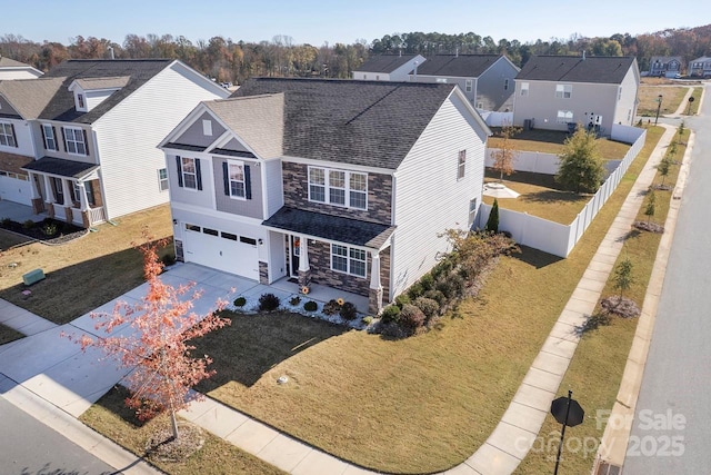 view of front facade with a garage and a front yard