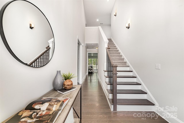 entryway featuring stairway and wood finished floors