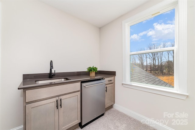 bar featuring a sink, light carpet, baseboards, and dishwasher