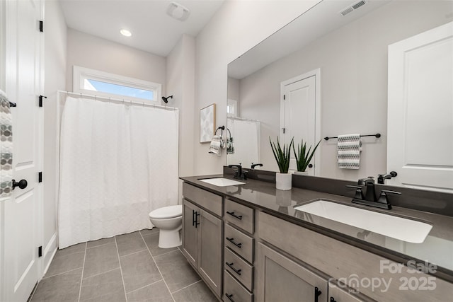 full bathroom with toilet, a sink, visible vents, and tile patterned floors