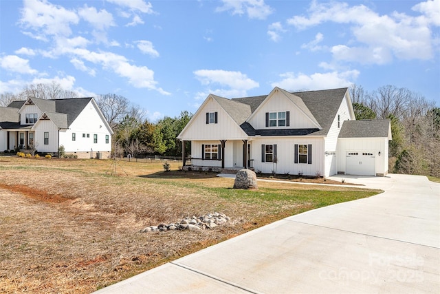 modern inspired farmhouse with driveway, a garage, board and batten siding, and roof with shingles