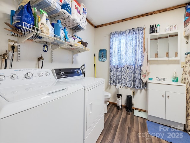 laundry room featuring separate washer and dryer, crown molding, and dark hardwood / wood-style flooring