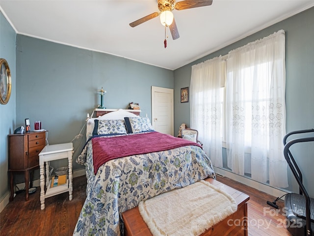 bedroom featuring dark wood-type flooring and ceiling fan