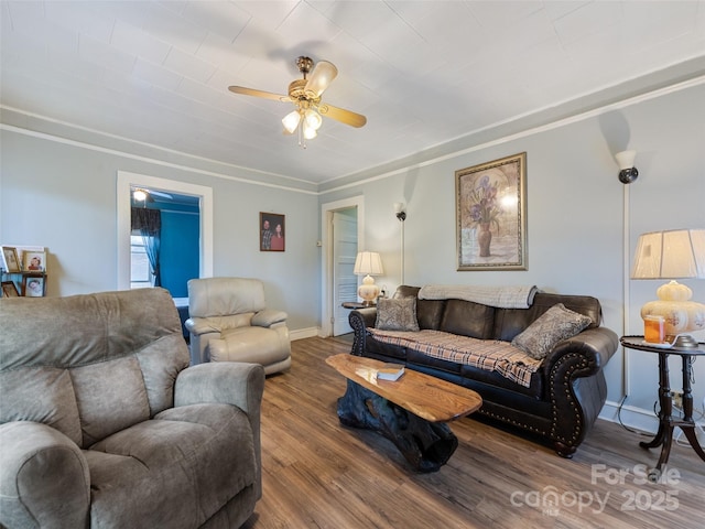 living room featuring wood-type flooring and ceiling fan