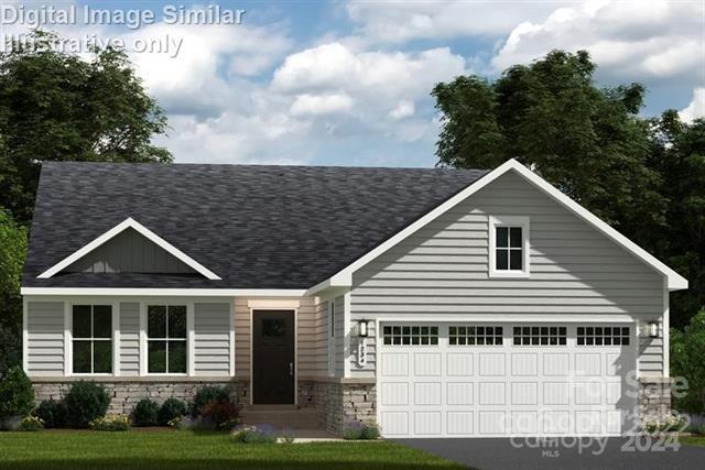 view of front of house with a garage and a front yard