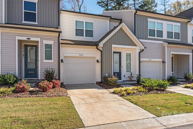 view of front facade with a garage and a front lawn