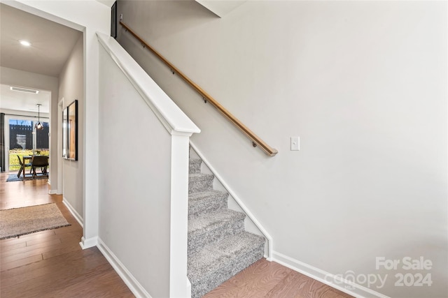 stairway with wood-type flooring