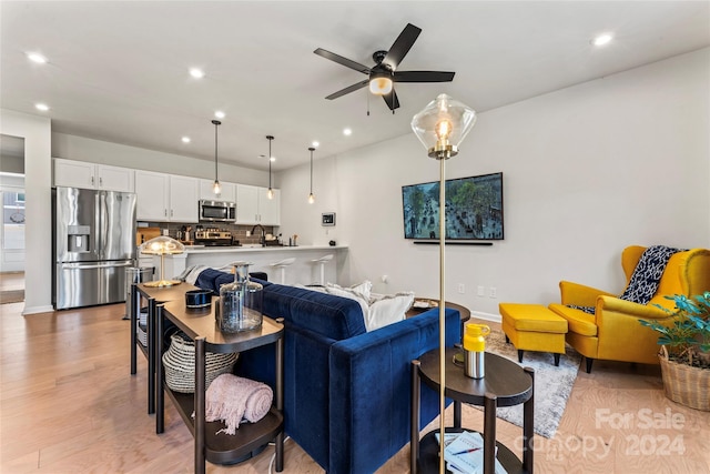 9232 Widden Way, Charlotte, NC 28269 - living room with recessed lighting, a ceiling fan, light wood-style flooring, and baseboards