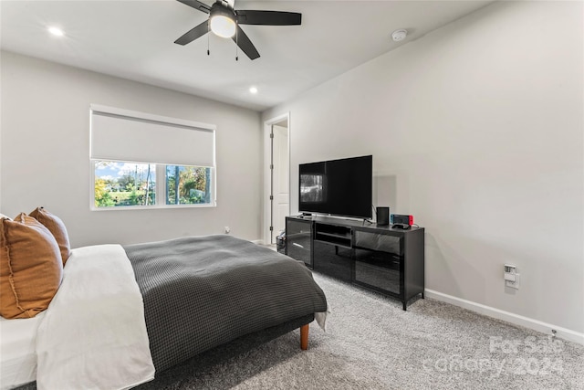 carpeted bedroom featuring ceiling fan