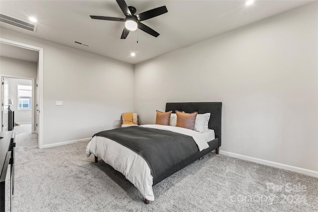 bedroom with ceiling fan and light colored carpet