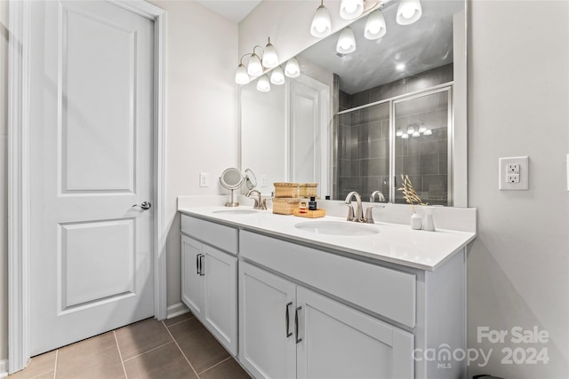 bathroom featuring tile patterned floors, vanity, and walk in shower