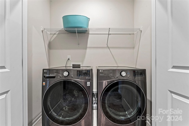 washroom with separate washer and dryer