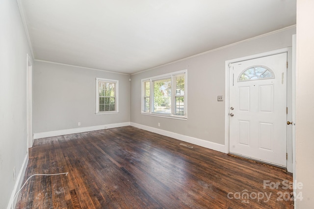 entryway featuring dark hardwood / wood-style floors and ornamental molding