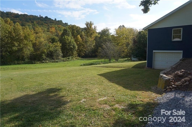 view of yard with a garage