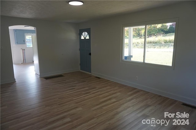 foyer with dark hardwood / wood-style floors