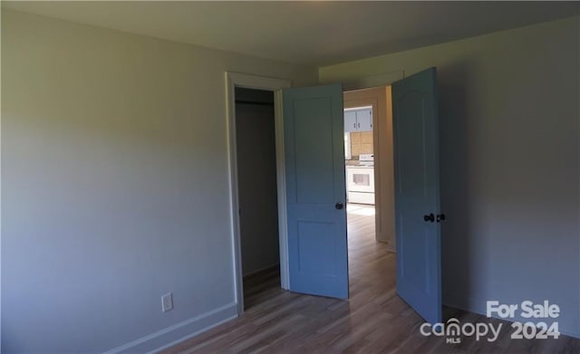 unfurnished bedroom featuring wood-type flooring