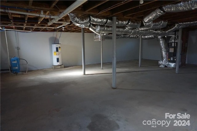 basement with heating unit and electric water heater