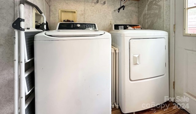 clothes washing area featuring washing machine and clothes dryer