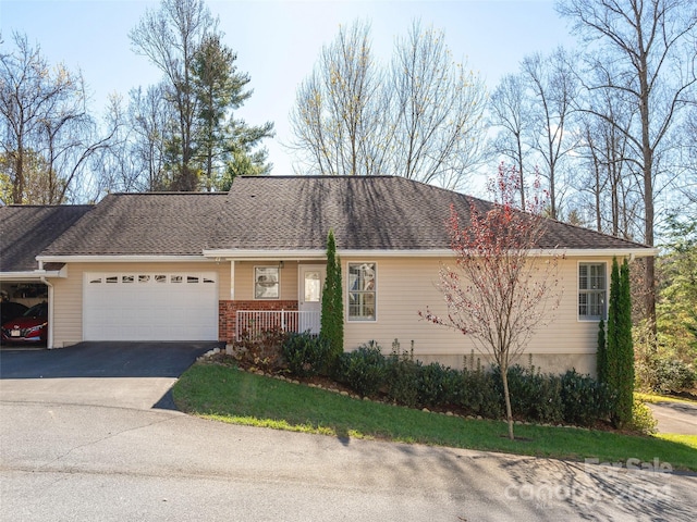 single story home featuring a garage