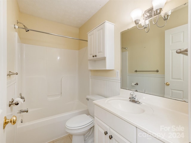 full bathroom featuring vanity, a textured ceiling, shower / bathing tub combination, tile patterned flooring, and toilet