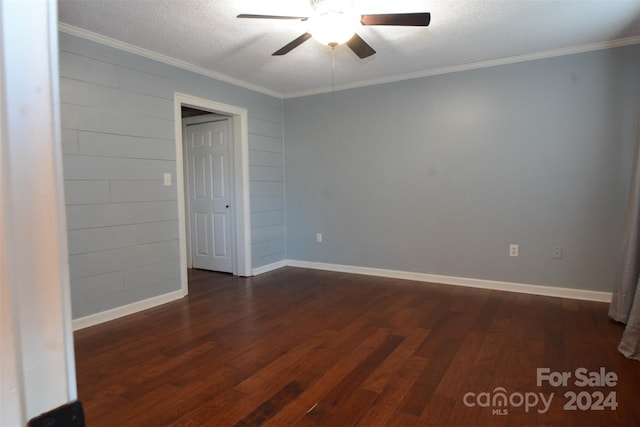 spare room featuring crown molding, dark hardwood / wood-style flooring, ceiling fan, and a textured ceiling