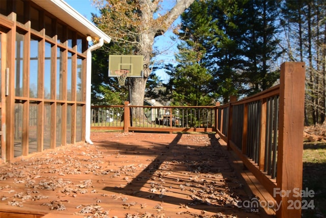 wooden deck featuring basketball court