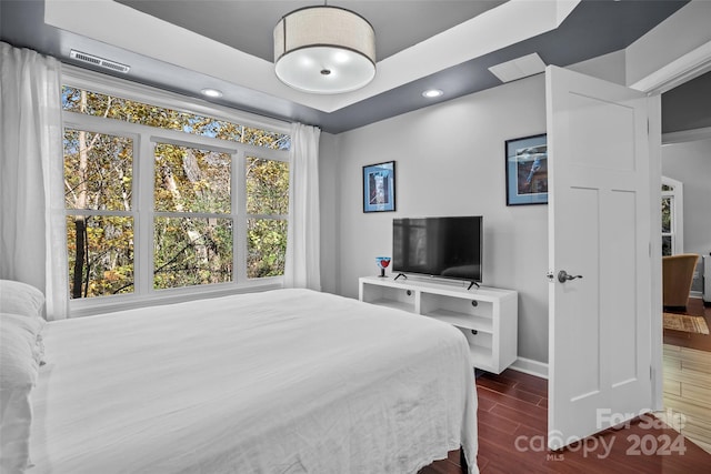 bedroom with hardwood / wood-style floors