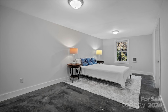 bedroom with dark carpet