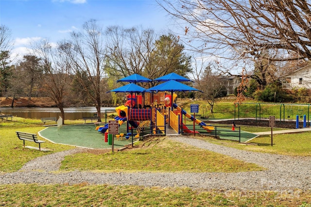 view of jungle gym featuring a water view