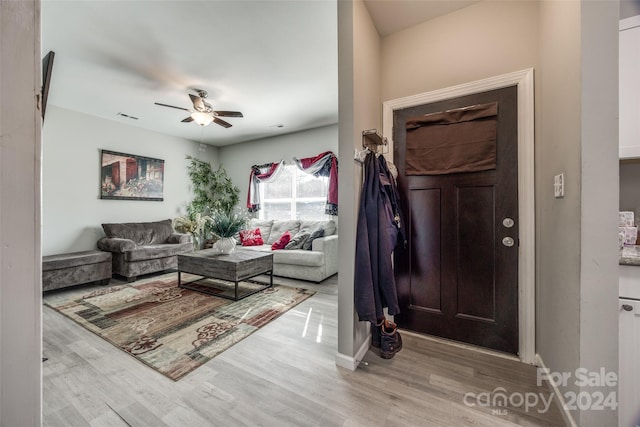 entrance foyer with ceiling fan and light hardwood / wood-style floors