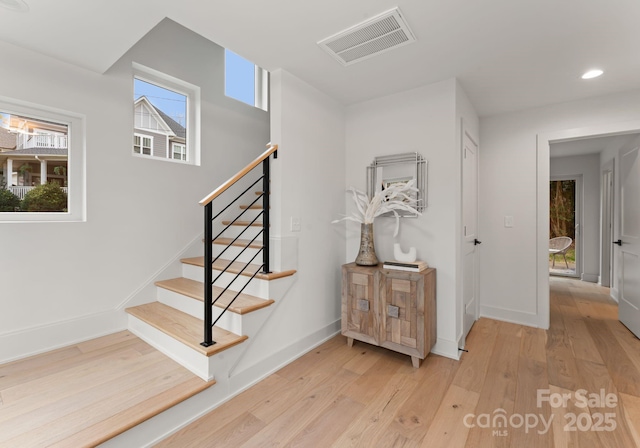 staircase featuring hardwood / wood-style floors