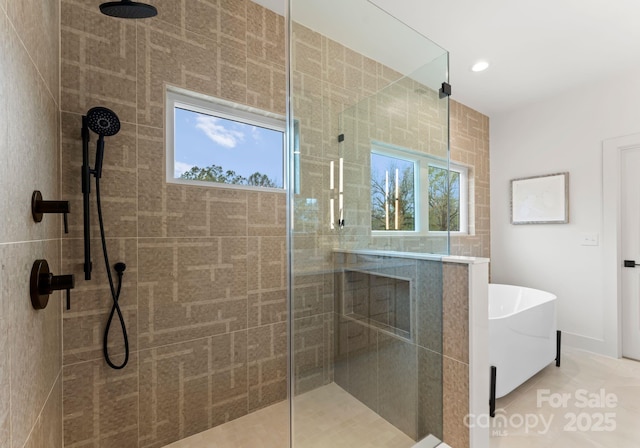 bathroom featuring plenty of natural light, independent shower and bath, and tile patterned flooring