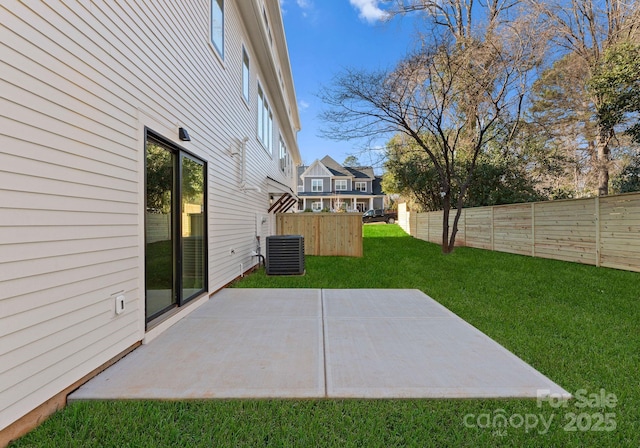 view of yard with a patio area and central AC