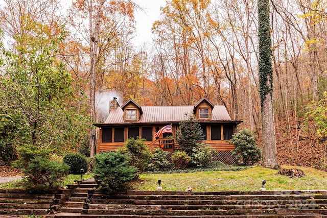 view of front facade with a sunroom