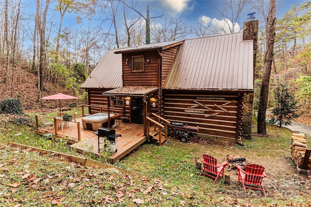 back of property with a wooden deck