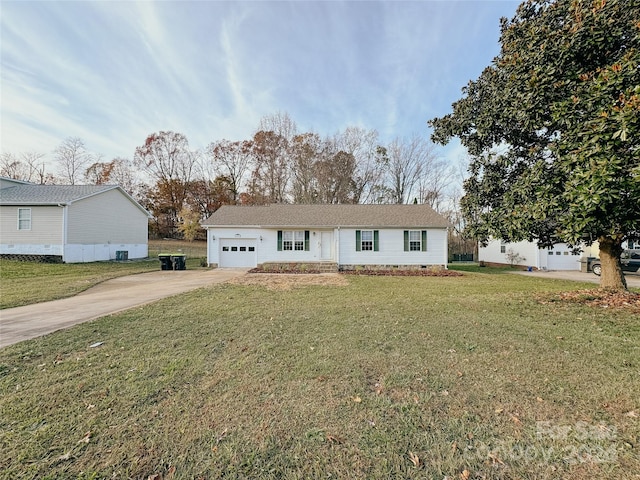 view of front of home featuring a garage and a front lawn