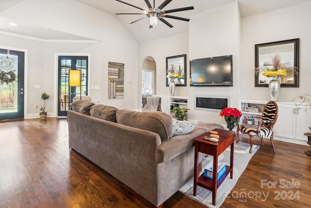 living room with lofted ceiling, ceiling fan, and dark hardwood / wood-style floors