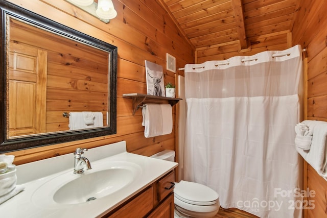 bathroom with lofted ceiling, toilet, wood walls, wooden ceiling, and vanity