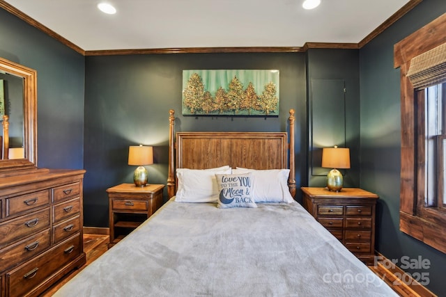 bedroom featuring dark hardwood / wood-style flooring and crown molding