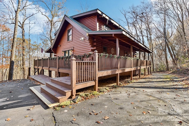 view of home's exterior featuring a deck