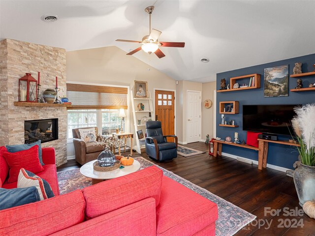 living room with a fireplace, dark hardwood / wood-style flooring, vaulted ceiling, and ceiling fan