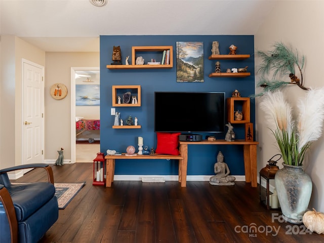 living room with dark hardwood / wood-style flooring