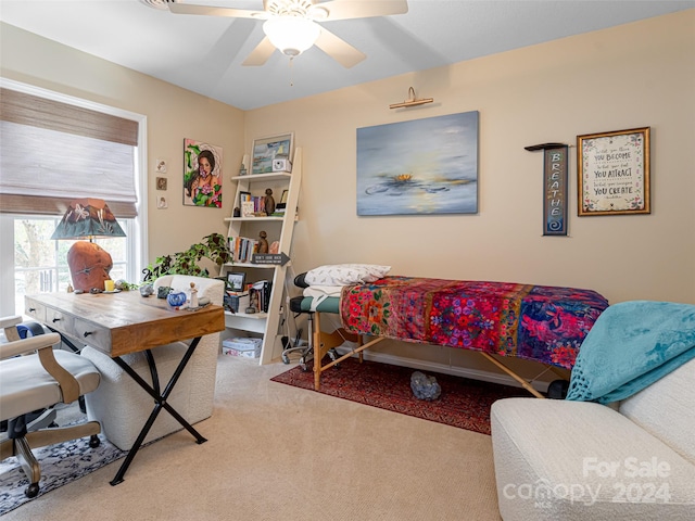 bedroom with ceiling fan and light carpet