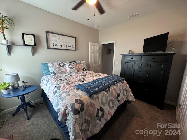 bedroom featuring dark colored carpet and ceiling fan