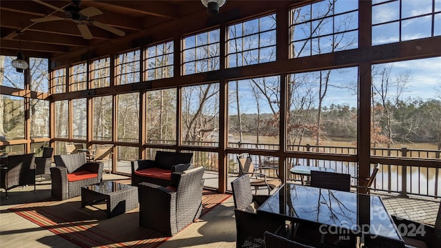 sunroom featuring ceiling fan and a healthy amount of sunlight