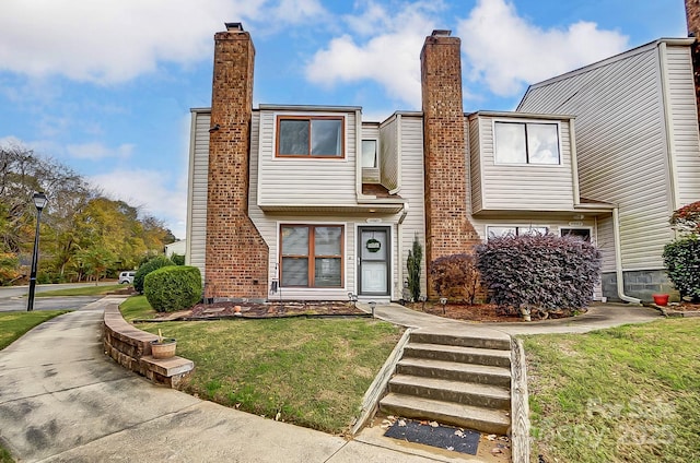 view of front of home with a front yard